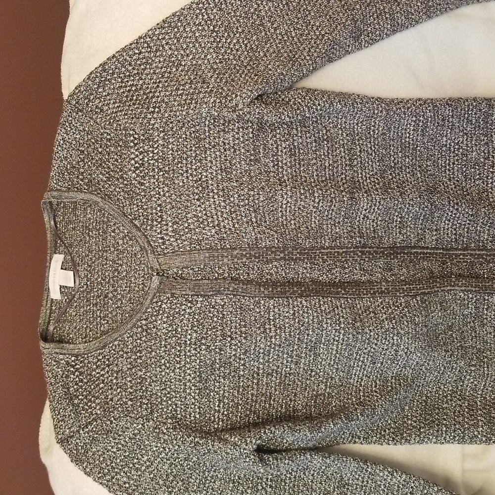 Sweater with hooks closure. Silver/metal color.  Like new, been worn only ones